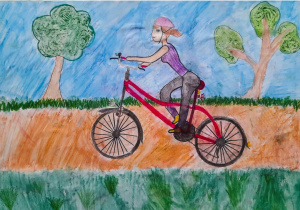 praca konkursowa przedstawiająca rowerzystę jadącego drogą z prawa na lewo
